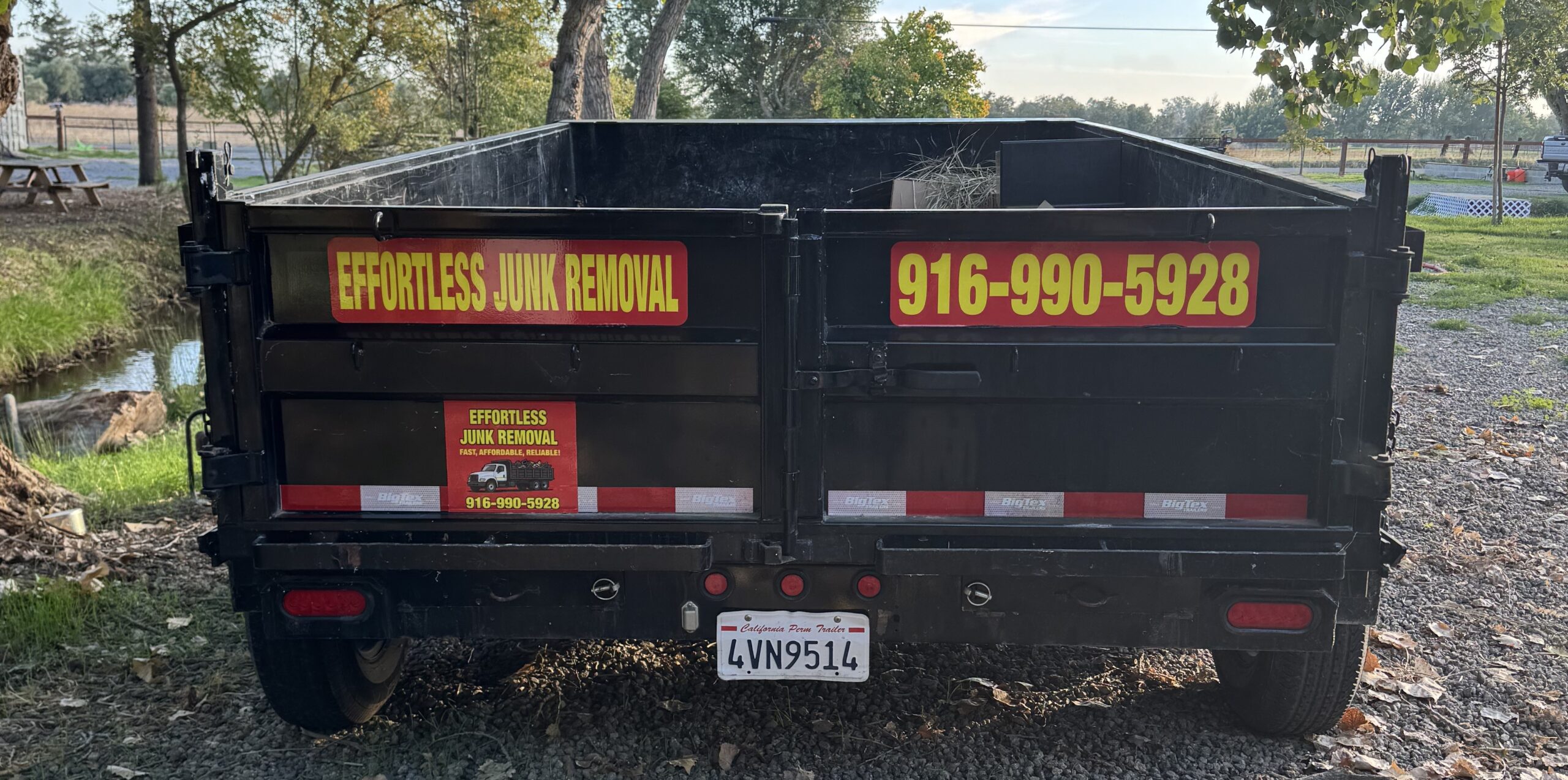 Effortless Junk Removal truck and trailer on the job